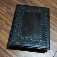 Antique wooden box with metal lock and wood carvings