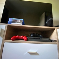 TV with stand and PS4 console( 5 games included)