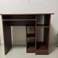 Wooden table with shelves and sliding drawer