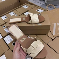 ZARA  Flat leather sandal shoes with a cross-strap detail on the front.